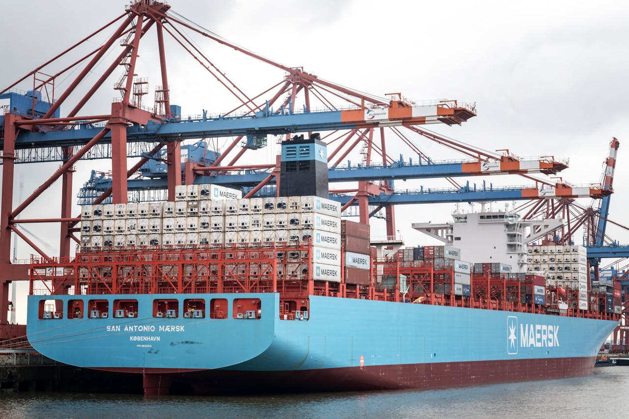 about-us Container ship docked at the Port of Hamburg, showcasing industrial logistics.