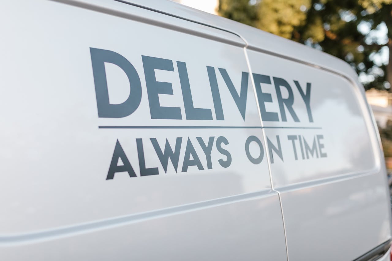 who-we-are Close-up of delivery van with slogan 'Always On Time' emphasizing timely service.